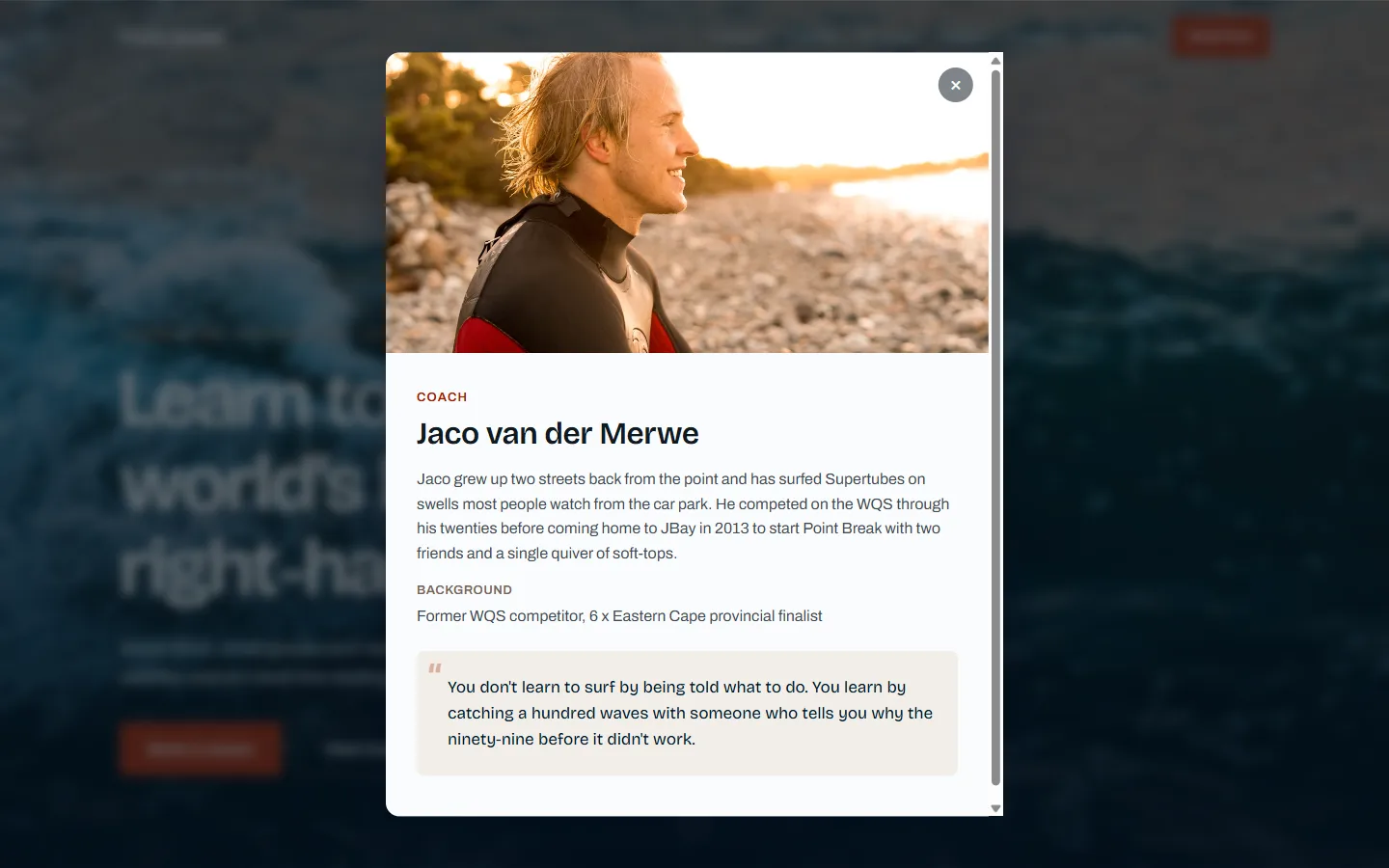 The coach bio modal open on the live site, showing a founder's background and coaching philosophy
