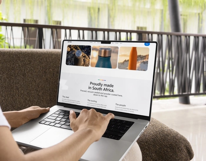 Hands typing on a laptop keyboard with the B3TTER site open