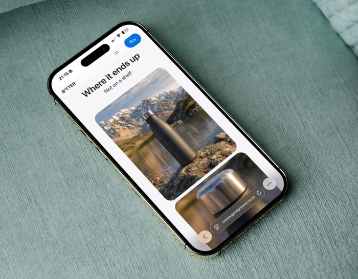 A phone showing the B3TTER site held in one hand